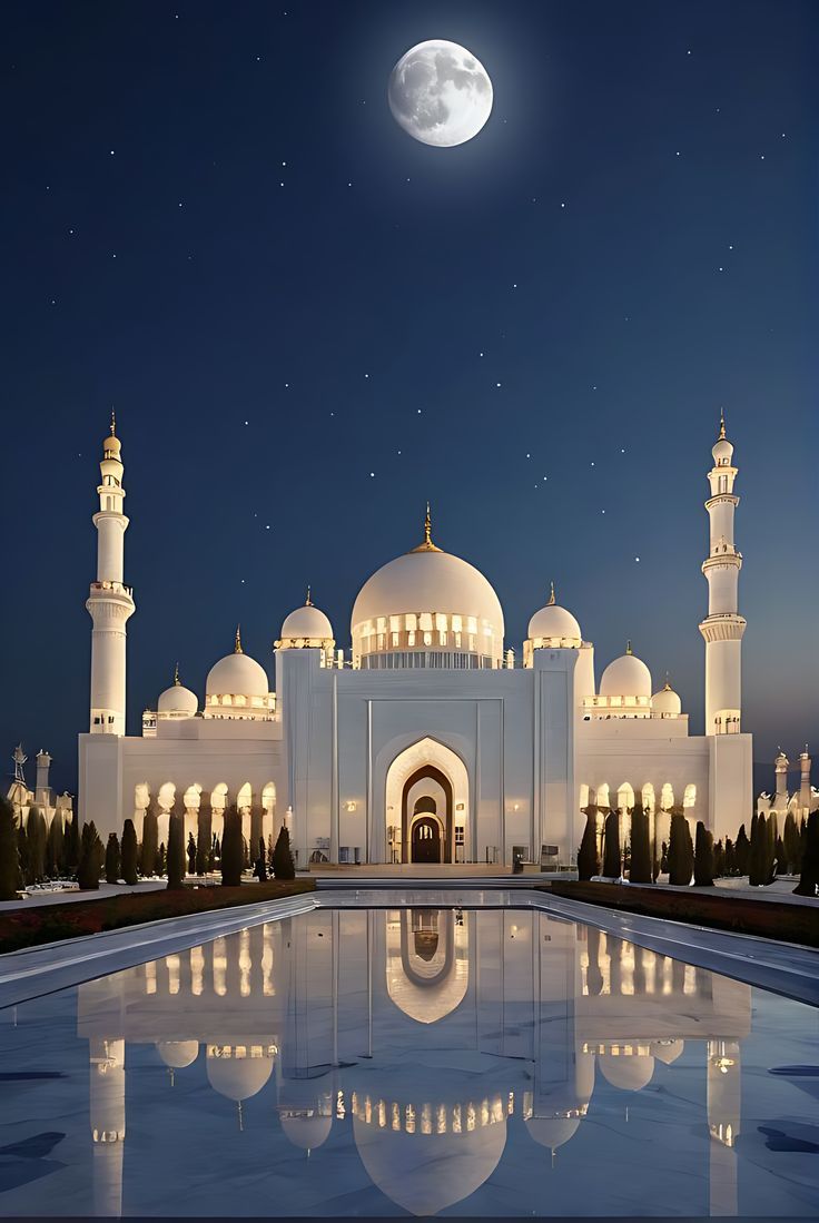 a large white building sitting under a full moon