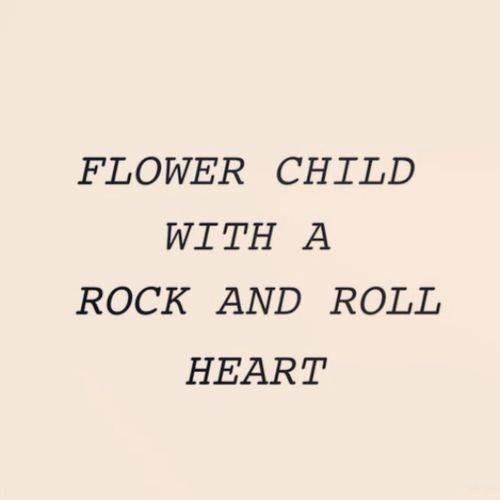 the words flower child with a rock and roll heart in black on a white background