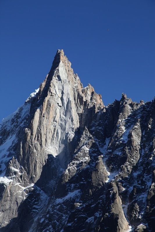 the top of a mountain with snow on it