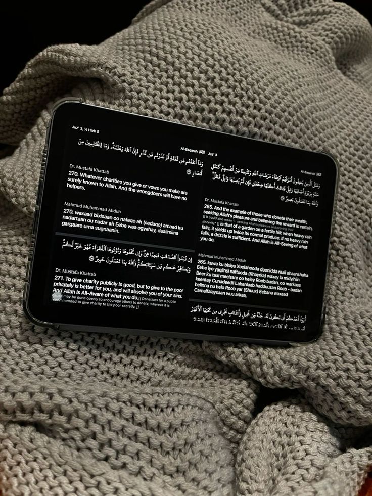 an electronic device sitting on top of a blanket