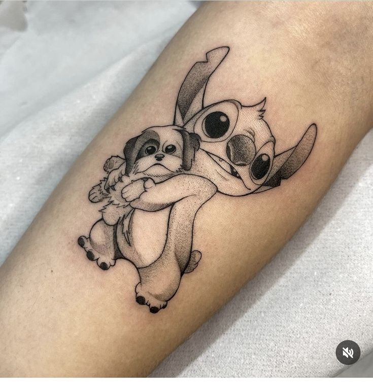 a tattoo with two koalas hugging each other