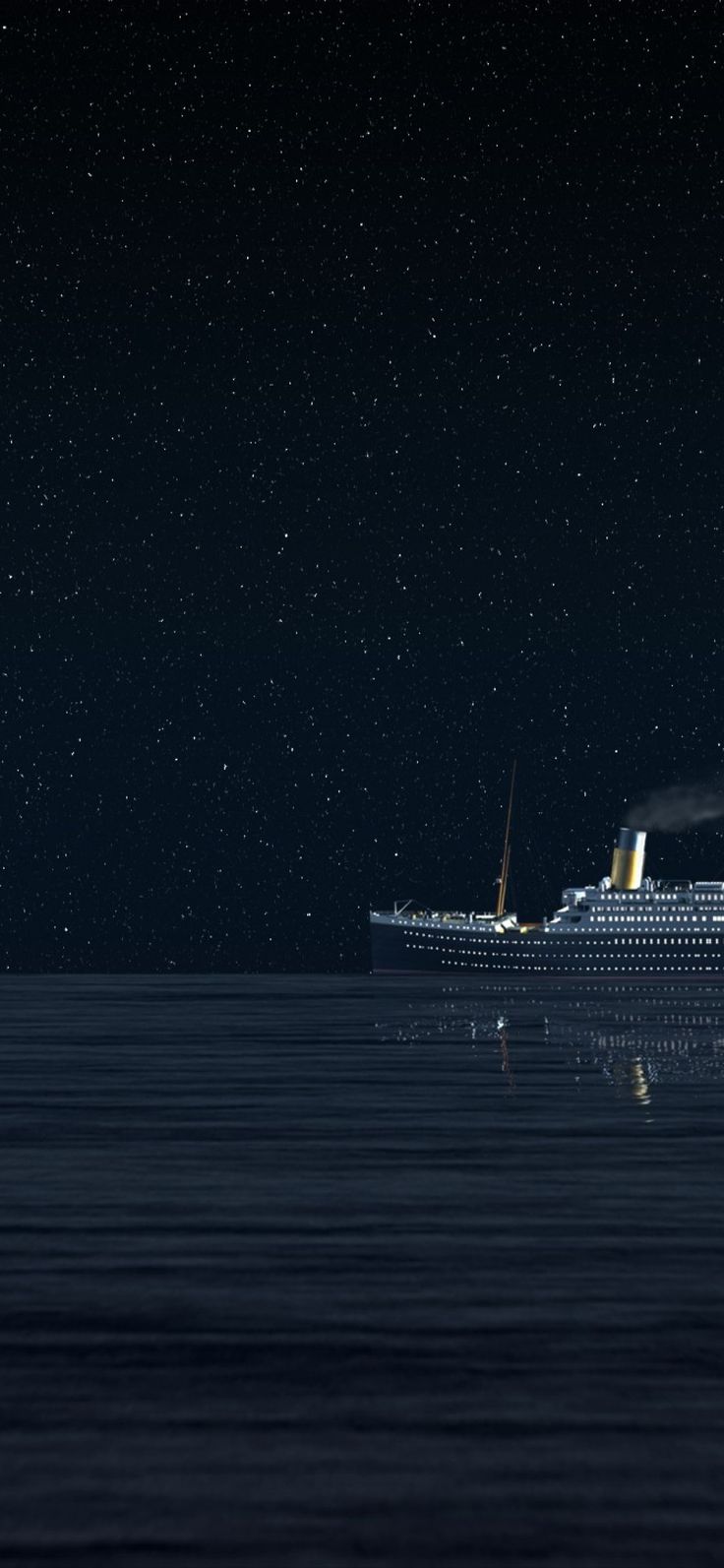 a cruise ship floating in the ocean at night