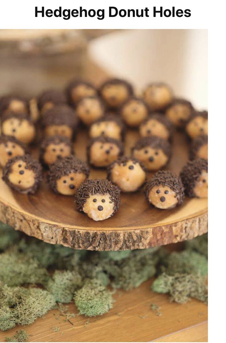 there are many little hedgehogs on the wooden platter