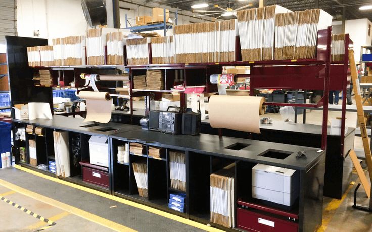 the shelves are full of files and other items in the storage area at the store