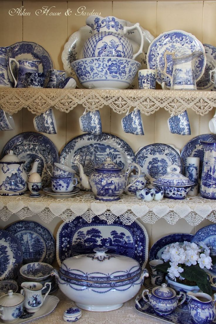 blue and white china on display in a store