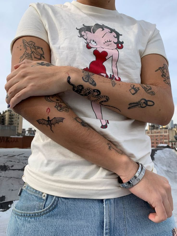 a man with tattoos on his arms and chest