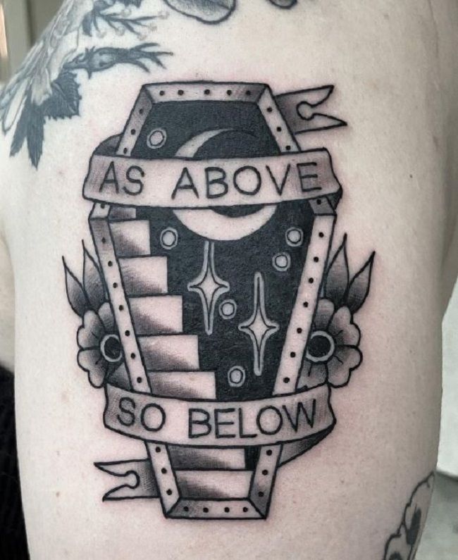 a man with a tattoo on his arm that says as above so below, and an arrow in the middle