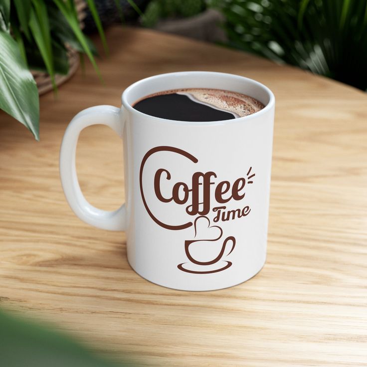 a coffee cup sitting on top of a wooden table