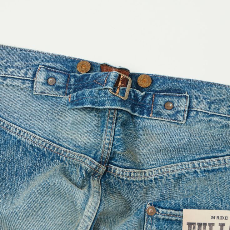 Inspired by the earliest days of denim production, the Son of the Soil jean from Fullcount boasts a wide leg, with a high rise, and plenty of heritage detailing. This jean has been cut from 13.7 ounce fabric, made up of hand picked Zimbabwean cotton. The jeans have been carefully faded to achieve a gorgeous heavy wash. Aged period correct buttons have been featured throughout, including brace buttons to add suspenders easily. As a final touch of heritage inspiration, the brand have included a custom manufactured cinch back buckle, which sits on top of the brand’s beautiful leather patch. Loose/straight leg High rise Button fly 13.7oz aged denim 100% cotton Custom aged tuck buttons Brace buttons at waistband Cinch Back Central leather patch Selvedge waistband Made in Japan Jean Gap In The Back, Jeans Leather Patch, Assignment Ideas, Workwear Boots, Denim Repair, Moc Toe Boots, Mountaineering Boots, Plain White Tee, Wing Shoes