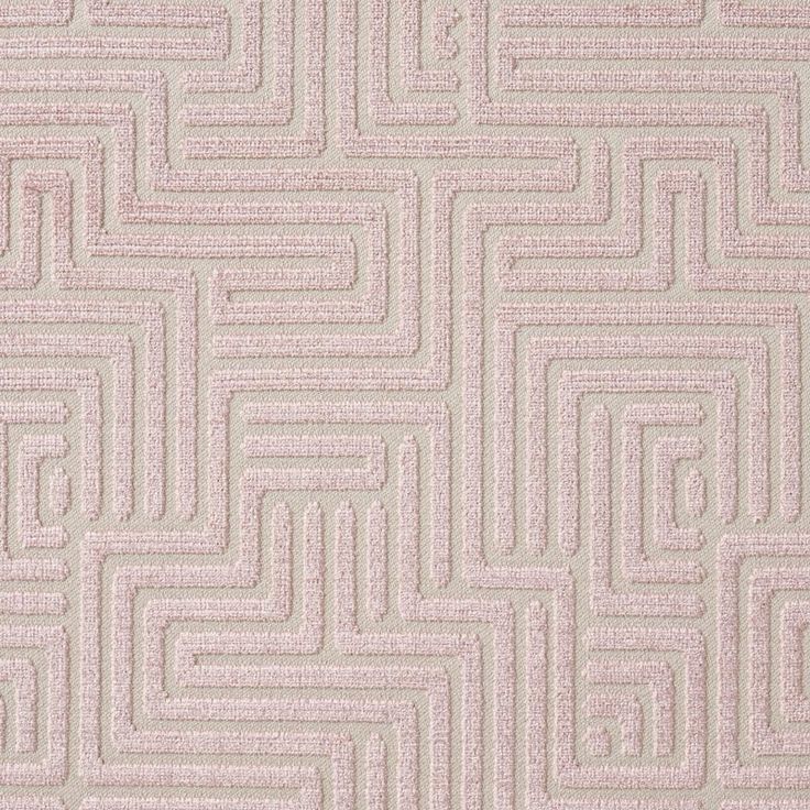 a pink rug with an abstract design on the top and bottom part of it's surface