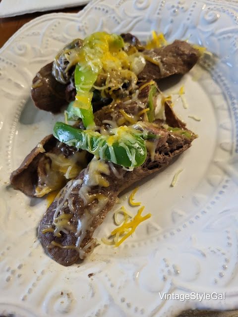 a white plate topped with food on top of a wooden table