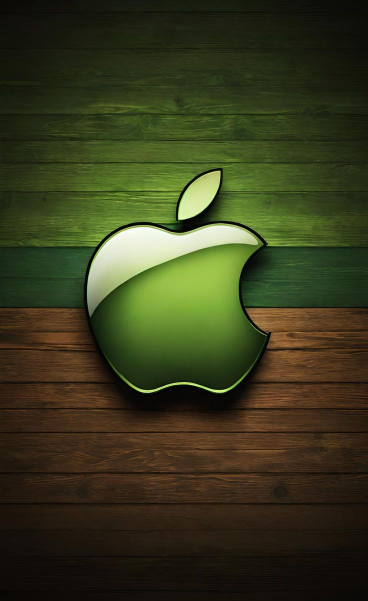 an apple logo on top of a wooden table with green and brown stripes in the background