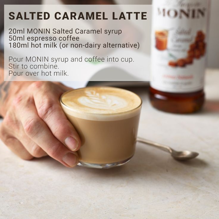 a person holding a cup of coffee with the label salted caramel latte