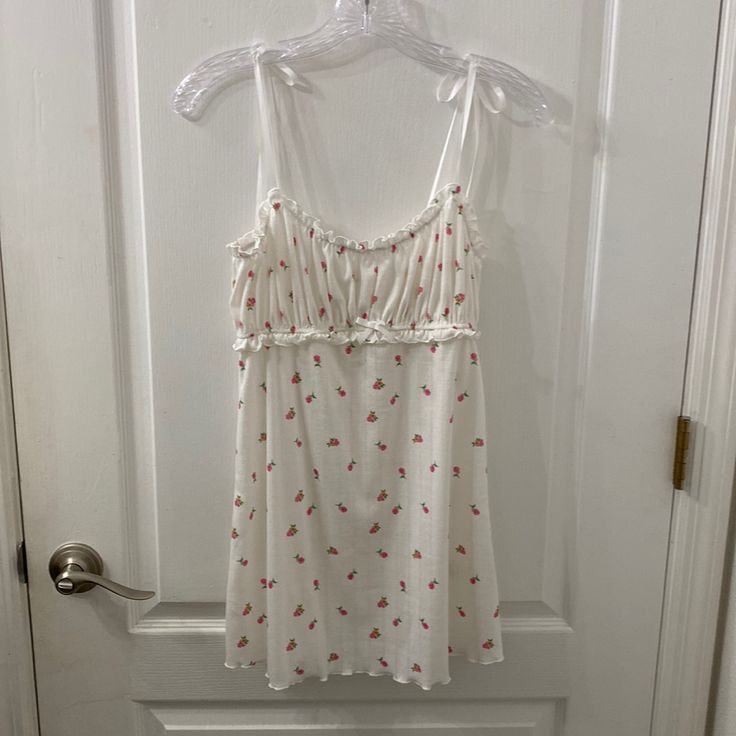 Never Worn. Adjustable Silky Straps. Small Pink Flowers. Length (From Shoulder To Hem): 30 Inches Offers Welcomed. Tags: Ingenue Casual White Mini Dress With Built-in Bra, White Casual Mini Dress With Built-in Bra, White V-neck Mini Dress For Loungewear, Casual White V-neck Nightgown, White Sleepwear With Built-in Bra For Spring, Flirty Summer Sleepwear With Built-in Bra, White Sleeveless Flirty Sleepwear, White Mini Dress With Built-in Bra For Brunch, Cute Summer V-neck Sleepwear