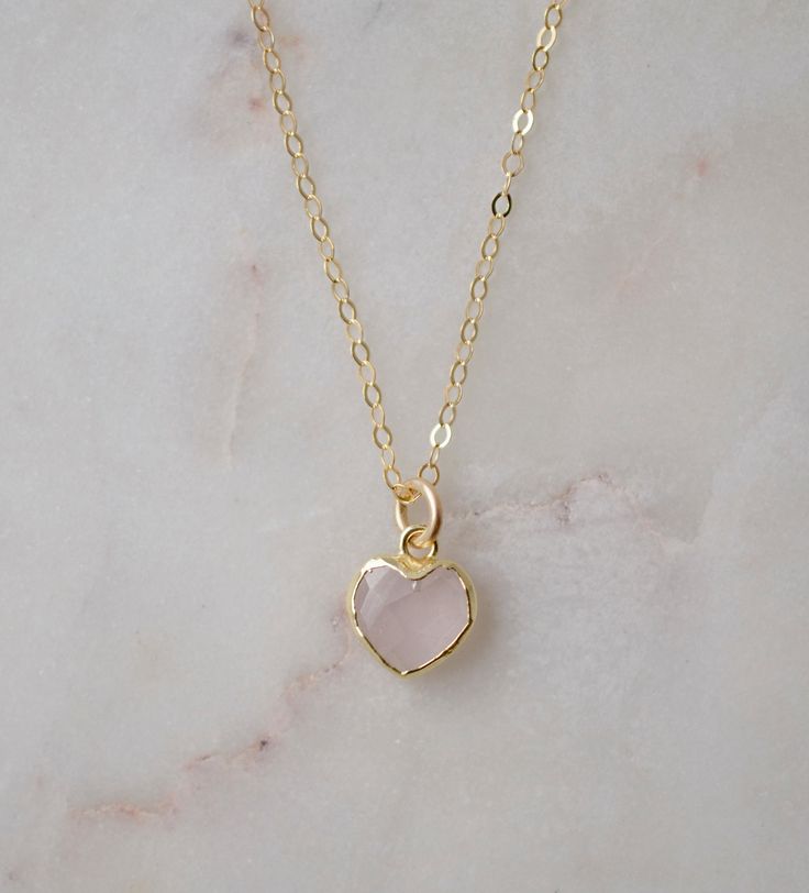 Looking for a unique accessory for some self love, or love for that special someone? Crafted from 14k gold filled and natural Rose Quartz, this pendant is the perfect, sparkling way to show anyone how much you care. Rose Quartz is a stone of love. It is believed to restore trust & harmony in relationships and encourage unconditional love. It purifies the heart and promotes self love, inner healing, and friendship. It is an alternate birthstone for January, as well as the spiritual birthstone for Rose Gold Heart Charm Jewelry With Pendant, Rose Gold Heart Charm Pendant Jewelry, Rose Gold Heart Pendant Jewelry With Heart Charm, Rose Gold Heart Charm Jewelry, Rose Gold Heart Charm Jewelry As Gift, Rose Gold Heart Charm Jewelry Gift, Handmade Rose Gold Heart Pendant Jewelry, Pink Gold Heart Charm Pendant Jewelry, 14k Gold Pink Jewelry With Heart Charm