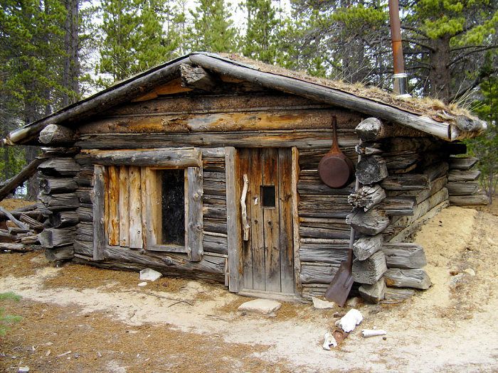 an old log cabin in the woods