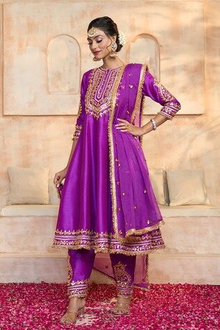 Purple anarkali in dupion base with floral pattern gota embroidered yoke, cuffs, hem and fringed lace details. Comes with matching dupion salwar and dupatta. - Aza Fashions Purple Chanderi Anarkali Set For Reception, Semi-stitched Tissue Silk Churidar With Gota Work, Dola Silk Anarkali Set For Diwali Reception, Dola Silk Cutdana Kurta For Reception, Reception Dola Silk Kurta With Cutdana, Chanderi Churidar For Eid Reception, Reception Cutdana Dola Silk Kurta, Embroidered Tissue Silk Churidar For Reception, Anarkali Churidar In Tissue Silk With Traditional Drape