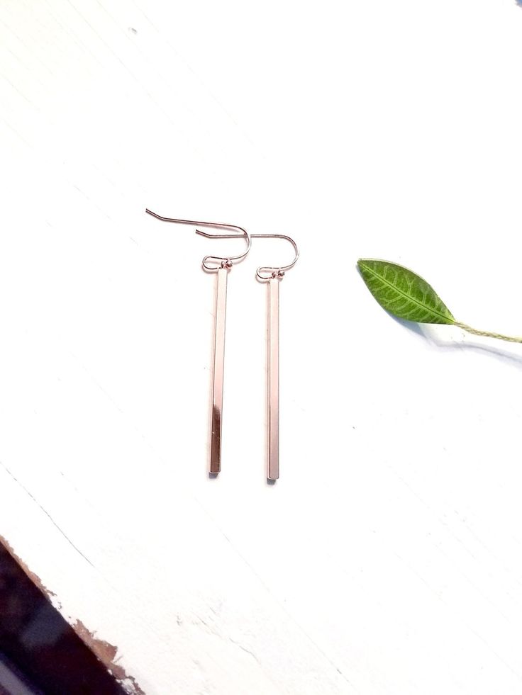 "Rose gold bar earrings Total length is 2\". -40 mm x 3 mm rose gold plated bar -16K rose gold plated ear wires All items come wrapped individually in a ribboned gift box." Rose Gold Linear Drop Earrings For Gift, Single Rose Gold Threader Earring As A Gift, Nickel Free Minimalist Rose Gold Earrings, Nickel-free Minimalist Rose Gold Earrings, Minimalist Nickel-free Rose Gold Earrings, Minimalist Rose Gold Threader Earrings, Rose Gold Dangle Linear Earrings As Gift, Simple Rose Gold Earrings With Ear Wire, Minimalist Rose Gold Linear Earrings For Gift