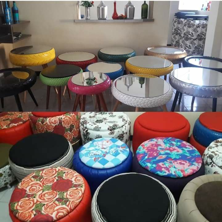 many different colored stools and tables in a room with mirrors on the wall behind them