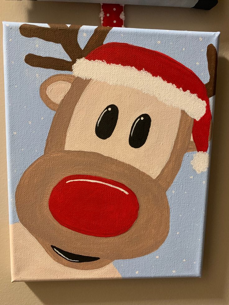 a painting of a reindeer with a santa hat on it's head and nose