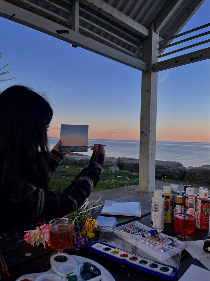 sunset painting on canvas ideas picnic date with friends aesthetic Painting Sunset Aesthetic, Canvas Picnic Date, Painting By The Beach Aesthetic, Painting On Beach Picnic, Outside Painting Aesthetic, Art Activities Aesthetic, Painting On Beach Aesthetic, Outdoor Painting Aesthetic, Painting Summer Aesthetic