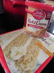 a bowl of ice cream sitting on top of a table next to a red container