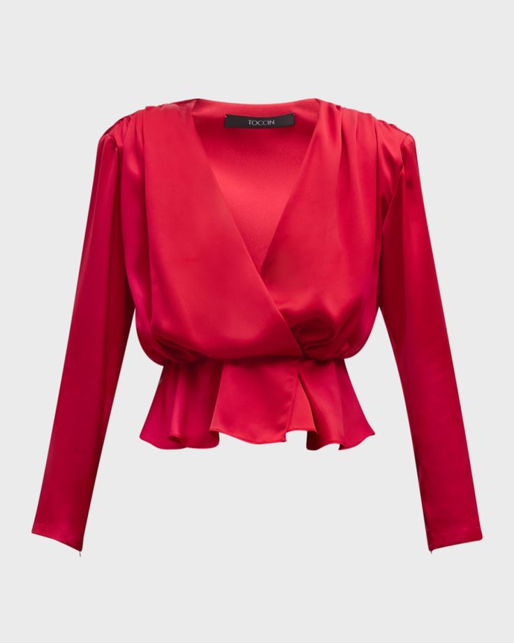 Toccin "Adeline" satin blouse featuring an elasticized waist that flows to a peplum hem    Approx. 21”L from shoulder to hem    Surplice neckline    Long sleeves    Hip length    Slipon style    Acetate/polyester    Lining: Polyester    Imported Satin Wrap Blouse, Red Peplum Tops, Surplice Top, Women Talk, Sequin Crop Top, Tie Neck Tops, Surplice Neckline, Tie Front Blouse, Peplum Hem