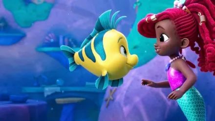 the little mermaid and her fish friend look at each other