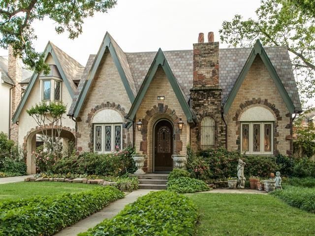 a house that has hedges in front of it