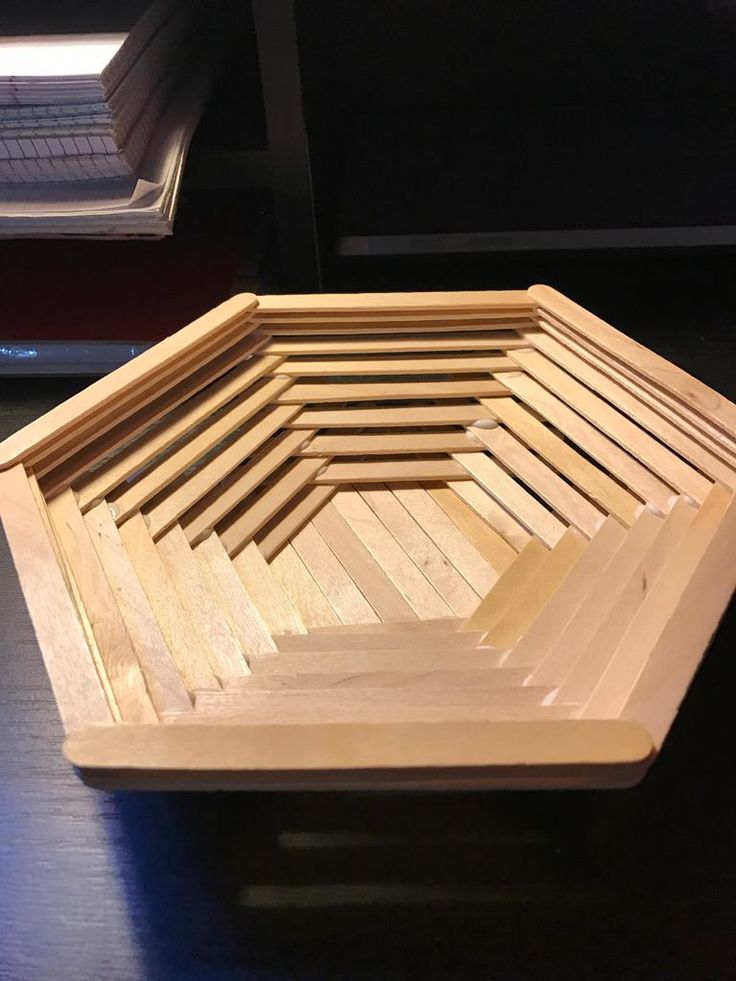 a wooden bowl sitting on top of a table