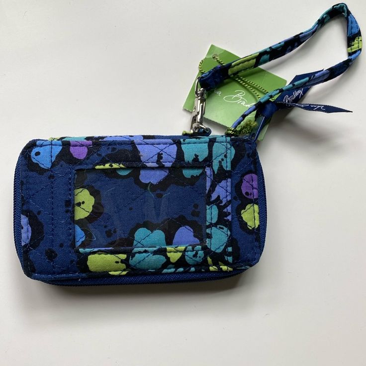 Vera Bradley All In One Wristlet Indigo Pop Pattern Zip Section For Cash/Change Multiple Credit Card Capacity Window For Photo Id Trendy Blue Wristlet For Daily Use, Blue Bags With Wrist Strap For Daily Use, Trendy Blue Wristlet For Everyday Use, Trendy Blue Everyday Wristlet, Blue Trendy Wristlet, Trendy Blue Wristlet, Blue Rectangular Bag With Wrist Strap, Blue Rectangular Wristlet With Zipper, Blue Wristlet For Travel