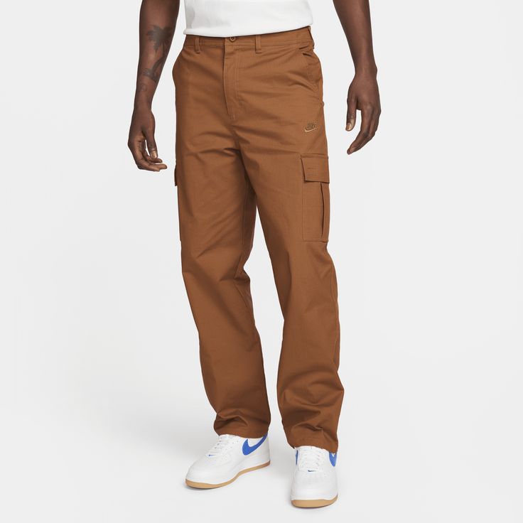 When your daily adventures call for lightweight, breathable comfort, pull on a pair of these cotton ripstop pants from our Nike Club collection. Cargo pockets offer plenty of storage while the relaxed straight-leg fit gives you a casual feel through the seat and thighs for easy, everyday wear. Mens Cargo Trousers, Men's Cargo Pants, Ripstop Pants, Soccer Shop, Mens Cargo, Ripstop Fabric, Cargo Pant, Cargo Pants Men, Cargo Trousers