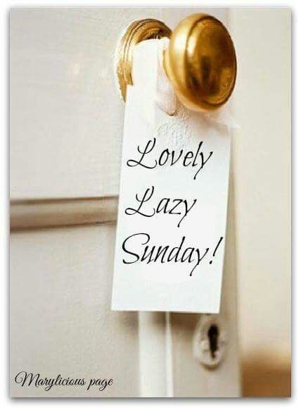 a white door with a sign that says lovely lazy sunday on it and a golden handle