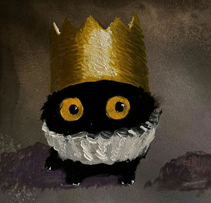 a black and white cat wearing a gold crown