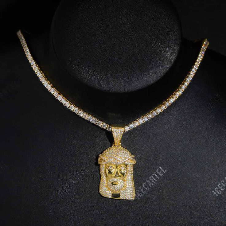 ICECARTEL exclusive Solid Face Jesus Pendant is now available, made of 925 sterling silver and PVD plated with a thick layer of 14K Gold. This moissanite pendant weights exactly 16 millimeters (excluding 3mm bail). This moissanite pendant is iced out with round cut, colorless (D-Color), VVS moissanite flawless diamonds, placed in a pave diamond setting. All of the diamonds on this moissanite pendant are guaranteed to pass the diamond tester. This ICECARTEL moissanite pendant ships insured, direc White Iced Out Round Pendant Necklace, Iced Out White Round Pendant Necklace, White Gold Cubic Zirconia Jewelry With Box Chain, Yellow Gold Jewelry With Box Chain And Cubic Zirconia, Yellow Gold Cubic Zirconia Jewelry With Box Chain, Iced White Gold Cuban Link Jewelry, Iced Out Diamond White Pendant Necklace, Iced Cuban Link Necklace For Gift, Silver Diamond Cut Necklace Gold Plated