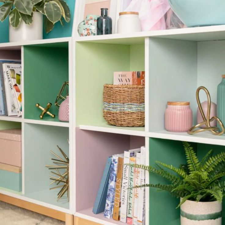 the shelves are filled with books and plants