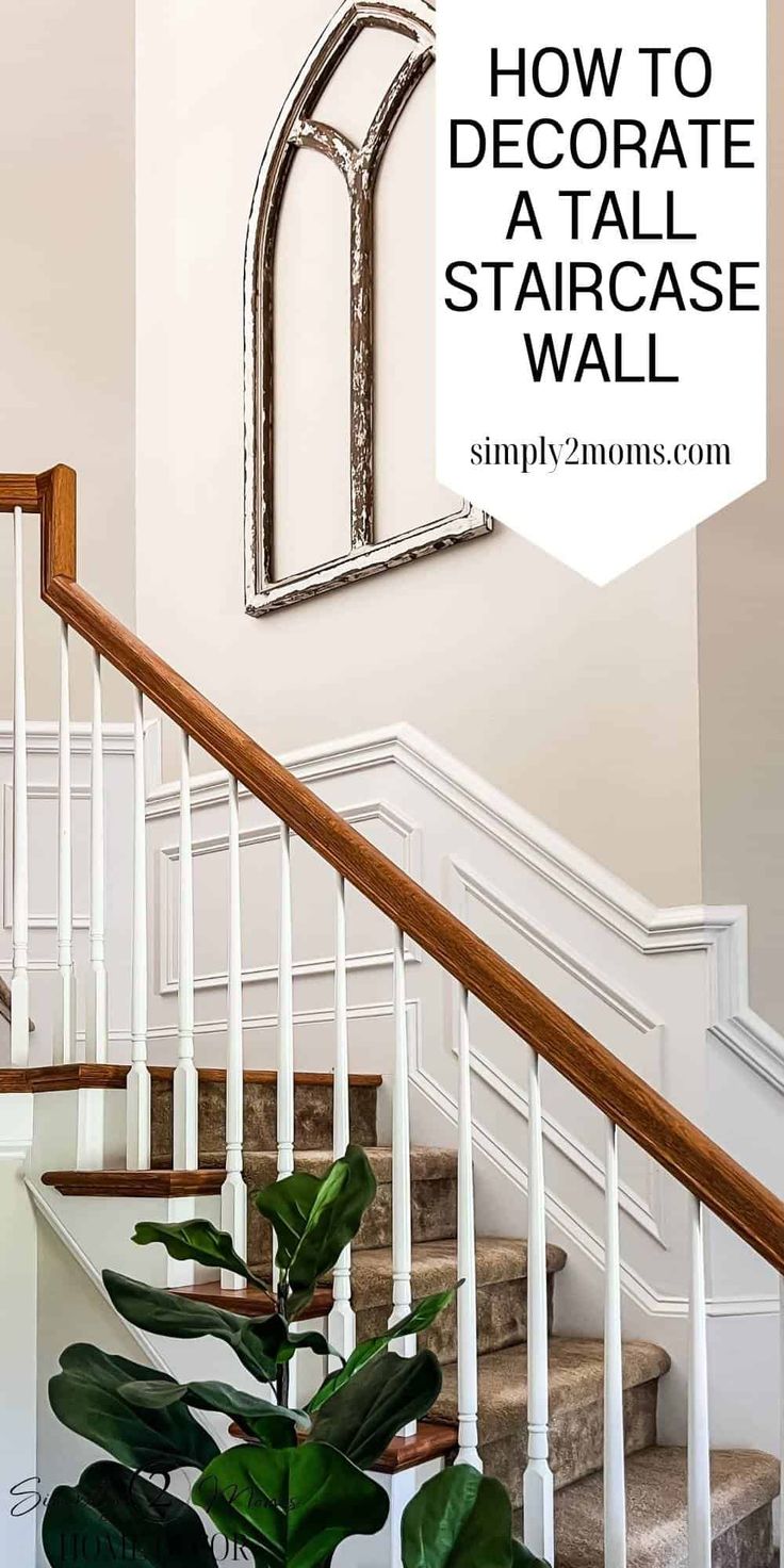 a plant sitting on top of a wooden stair case next to a white banister