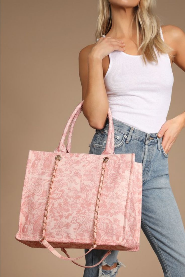 No need to sacrifice your essentials, the Lulus Got it All Pink Toile Print Tote Bag can carry them all and then some! This spacious and roomy flat bottom tote bag has a woven canvas construction (with a pink toile print throughout) has a lined interior, complete with a zipper pocket and two sidewall pouches. Twin tote handles and removable shoulder straps. Lined. Bag measures 15" wide, 12. 5" tall, and 7" deep (relaxed). Tote handles have A 8. 5" drop. Detachable 31" adjustable shoulder stra100% Polyester. Imported. Lulus | Got it All Pink Toile Print Tote Bag | 100% Polyester. Pink Canvas Tote Bag For Errands, Pink Tote Canvas Bag For Errands, Pink Double Handle Canvas Bag For Errands, Pink Canvas Bag For Errands, Pink Tote Canvas Bag For Shopping, Pink Square Canvas Bag, Pink Square Canvas Bag For Shopping, Pink Square Canvas Bag For Travel, Casual Pink Canvas Tote Bag