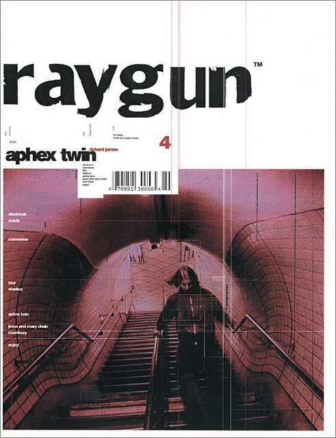 an advertisement for raygunn magazine with a man on the escalator in the background