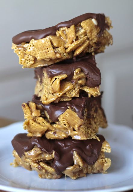 three pieces of chocolate and peanut butter granola bars stacked on top of each other