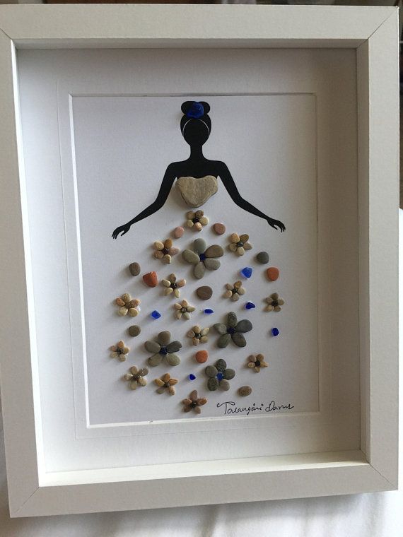 a white frame with buttons in the shape of a woman's body on it