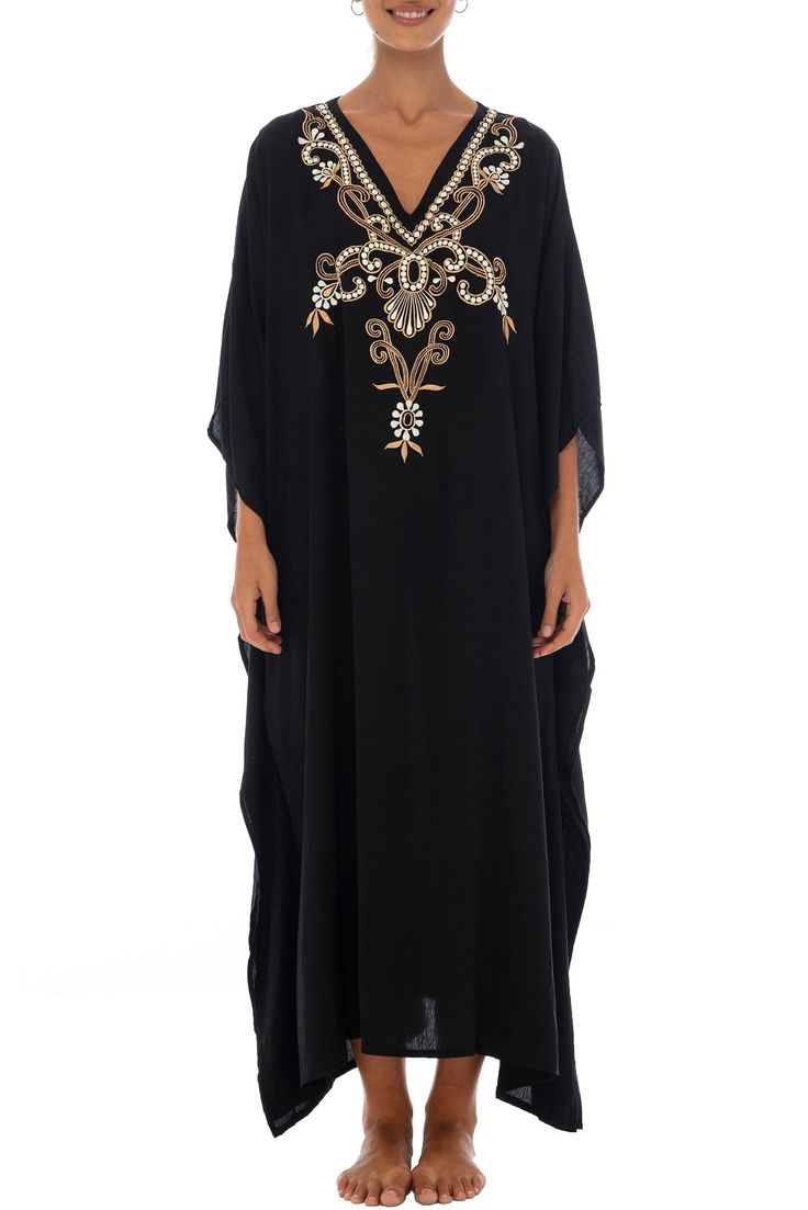 Add a tribal twist to your beach time in this black and gold summer maxi swimwear cover up. Zigzag embroidery adds a spicy accent to this long beach caftan, with a casual vacation vibe and a loose flowy fit that works beautifully on plus sizes. It offers great sun coverage, and is so easy to wear for cruises, lounging, vacation or relaxing days at the beach. Back From Bali is dedicated to creating beautiful, quality clothing with a heart. All of our items are crafted, sewn and painted by hand in Bali, by local artists and women who own small home businesses. For over 20 years, we have nurtured fair, honest and caring relationships with our artisans and their families – so you can feel as good about wearing our products as they feel about making them. Make waves in this black summer maxi sw Embellished Maxi Dress For Vacation, Embellished Beachwear Dress For Vacation, Flowy Long Abaya For Vacation, Embroidered Beachwear Kaftan For Beach, Summer Vacation Embellished Maxi Dress, Embroidered Tunic Abaya For Vacation, Embellished Maxi Dress For Summer Vacation, Embellished Dresses For Beach Season, Embroidered Beachwear Dresses For Beach Season