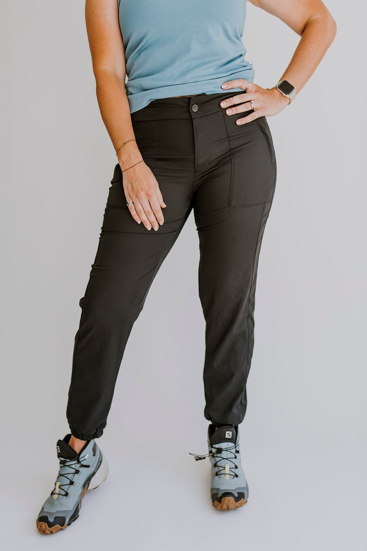 Finally pants that are functional and fashionable. No more choosing between cargo pants or yoga pants for your adventures, Go anywhere in the Vera Jogger; rappelling, rock climbing, canyoneering, or hiking. You name it, these pants can handle it. women's joggers, women's black joggers, women's hiking pants, best women's hiking clothing, adventure clothing brand, Olli, cute pants, outdoor clothing, hiking outfit ideas, cute outfit. Stretch Tapered Leg Outdoor Pants, Stretch Pants With Comfort Waistband For Outdoor Activities, Stretch Tapered Leg Pants For Outdoor Activities, Athleisure Pants With Functional Pockets For Hiking, Relaxed Fit Hiking Pants With Pockets, Athleisure Hiking Pants With Functional Pockets, Utility Cargo Pants For Hiking With Relaxed Fit, Stretch Functional Parachute Pants For Outdoor, Utility Bottoms With Side Pockets For Adventure