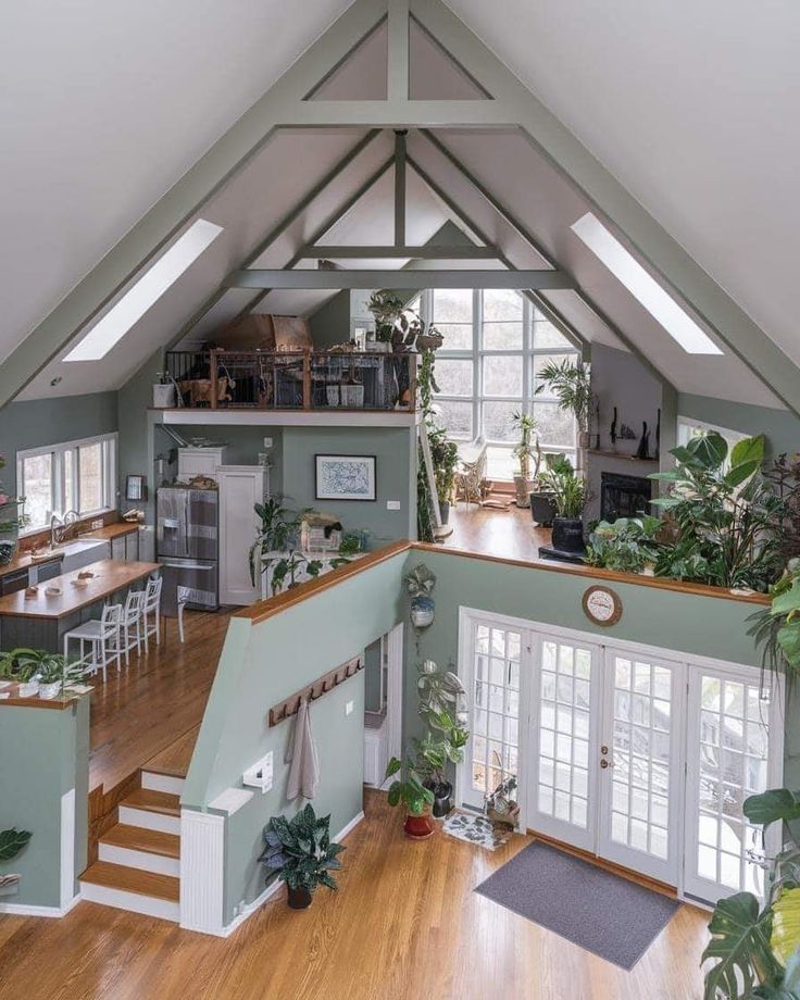 the inside of a house with wooden floors and green walls