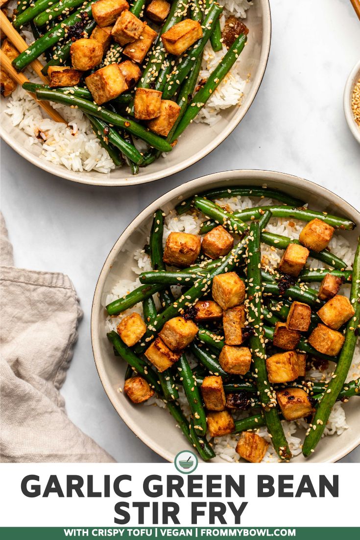 two plates filled with green bean stir fry on top of rice and chopsticks