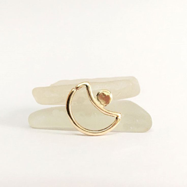 Lovely 14K solid gold piercing jewelry moon ring, perfect as a septum ring or daith earring✨. Each ring is stamped with a 14K gold marking for quality assurance. Super comfortable and ideal for long daily use. Made to order, this piece will arrive in a pretty gift box, ready to give or keep. 💡 All our jewelry is handcrafted in our home studio in Karmiel, Israel. 👉Want more fine septum / daith jewelry? Follow this link: https://www.etsy.com/shop/AraDeOro?ref=seller-platform-mcnav&section_id=179 Daith Jewelry, Daith Earrings, Daith Piercing, Septum Jewelry, Moon Ring, Septum Piercing, Nose Ring Stud, Gold Hoop, Body Jewellery