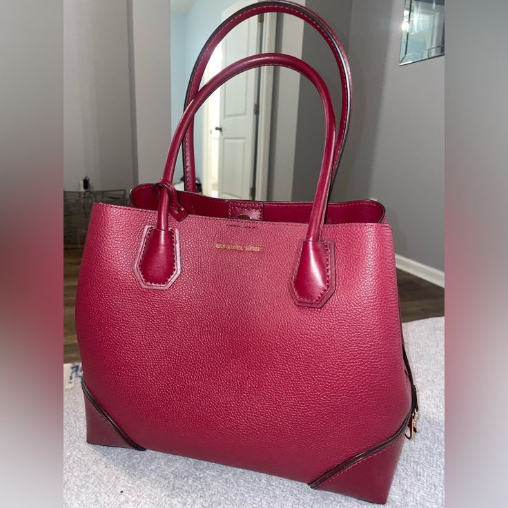 Burgundy Michael Kors Handbag With Middle Zipper Compartment And Two Open Sections. Within The Middle Zipper Is 5 Pockets And One Zipper Pocket. Little To No Blemishes On Bag. Formal Burgundy Bags With Branded Hardware, Elegant Michael Kors Satchel For Errands, Classic Michael Kors Satchel For Daily Use, Burgundy Top Handle Satchel For Errands, Elegant Burgundy Satchel For Errands, Classic Michael Kors Satchel For Errands, Red Bags With Branded Hardware For Errands, Burgundy Satchel With Detachable Handle For Shopping, Classic Burgundy Bags For Errands