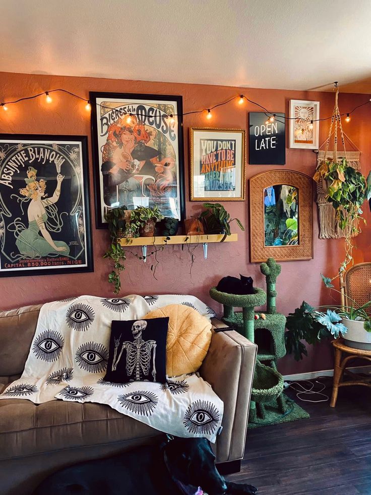 a living room filled with furniture and lots of pictures on the wall next to a black dog