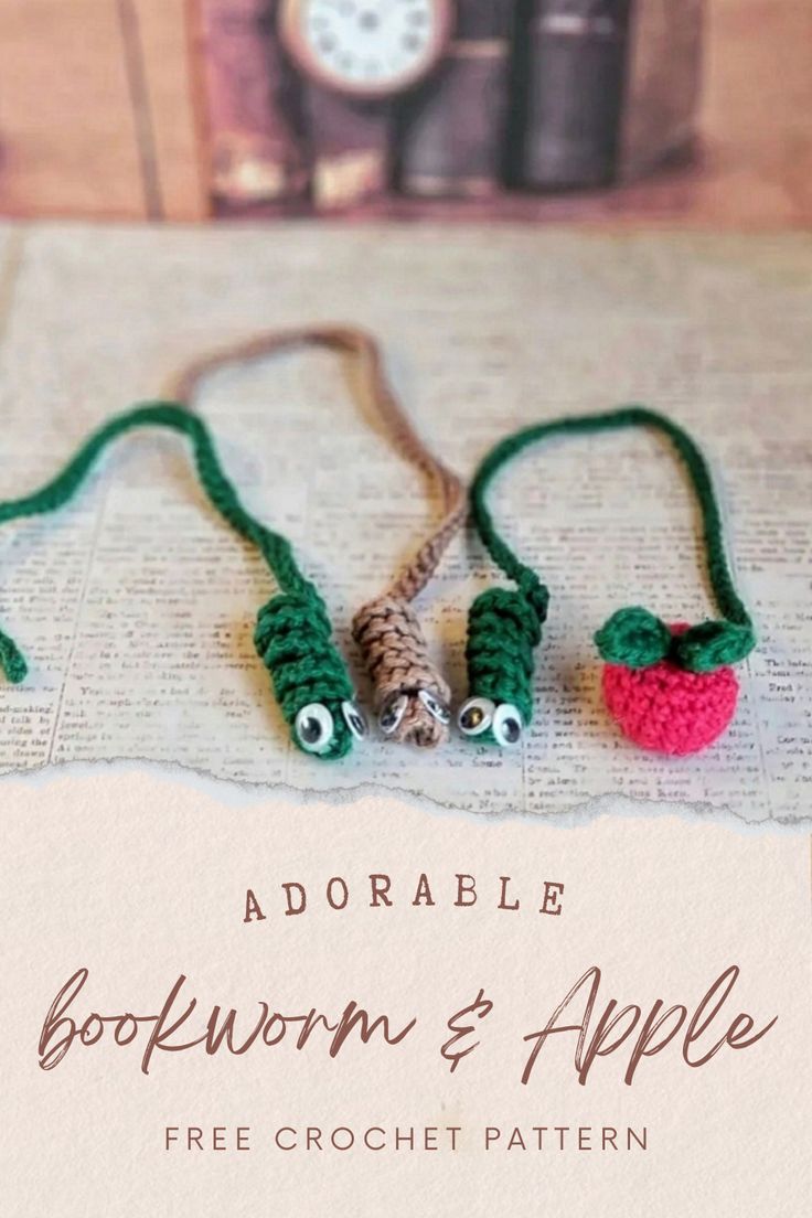 two small crocheted apples are on a book page with the title above them