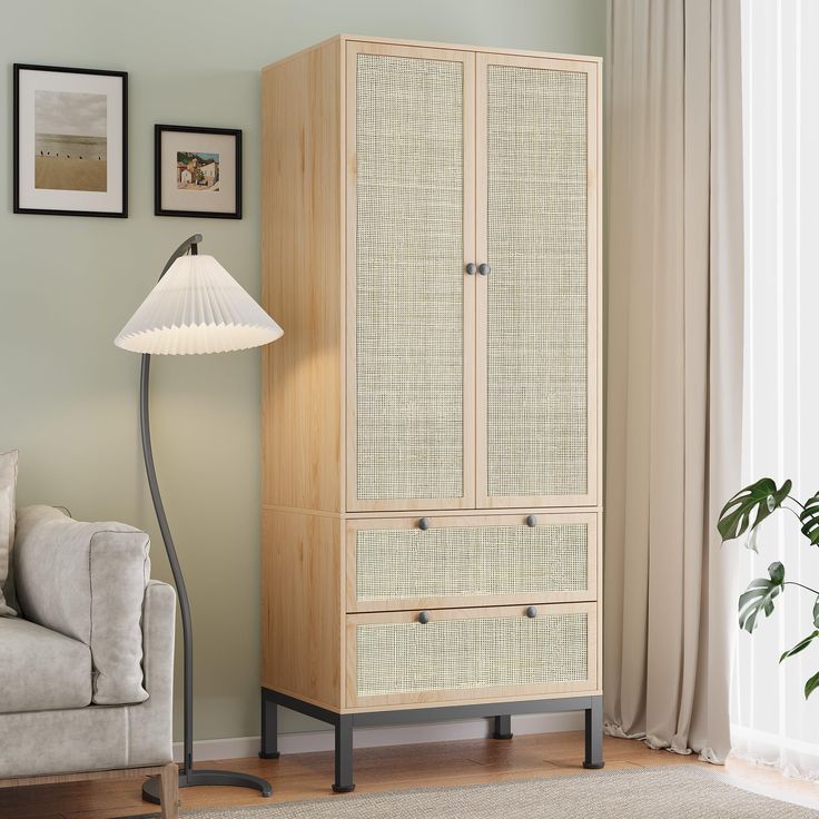 a living room with a couch, chair and cabinet